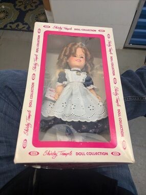 Shirley Temple Doll in Navy Floral Dress with White Apron